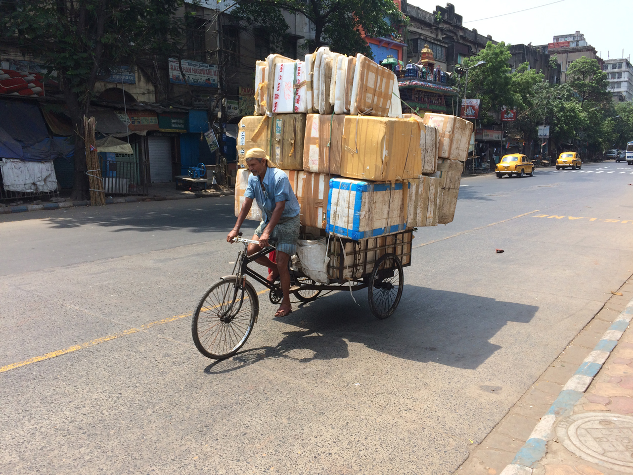 Man on bicycle with huge cargo
