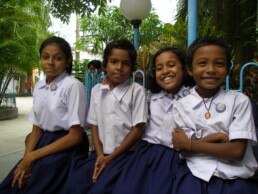 Kids in uniform smiling